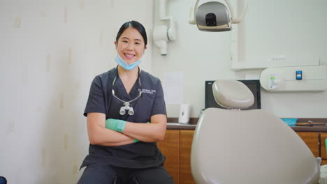 Portrait-of-a-confident-dentist-with-her-arms