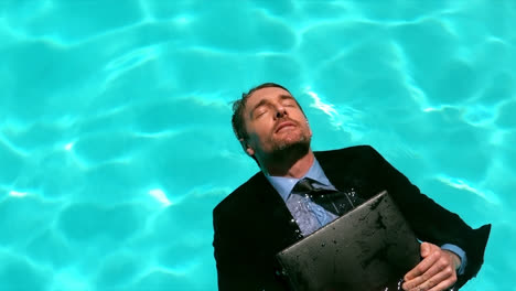 businessman floating in the pool