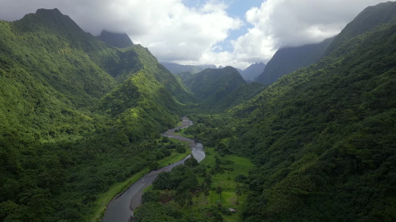 Valley Valle de Tautira Vaitia Teahupoo Mont Aorai Faretua North Shore Tahiti French Polynesia aerial drone Vaitepiha River Taravao canyon ravine jagged mountains green lush blue sky clouds forward