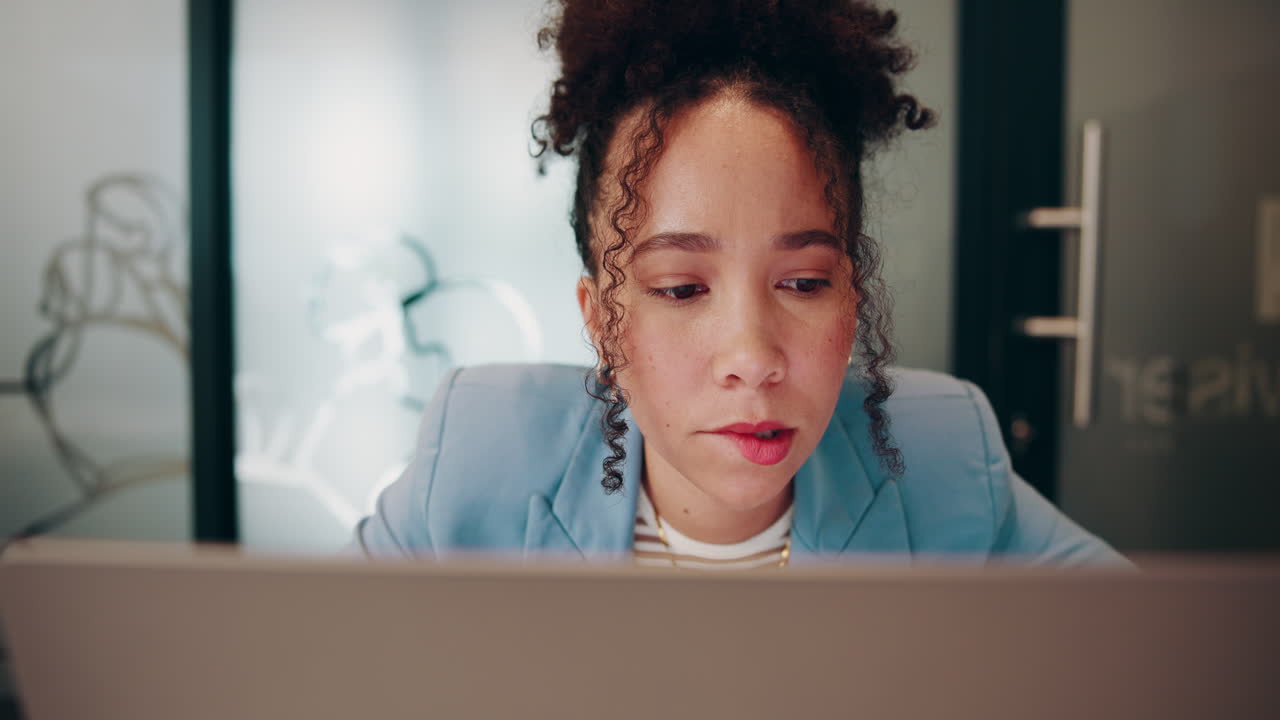 Businesswoman working on laptop in office