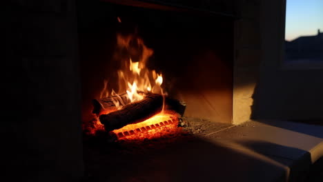 cozy fireplace with burning logs