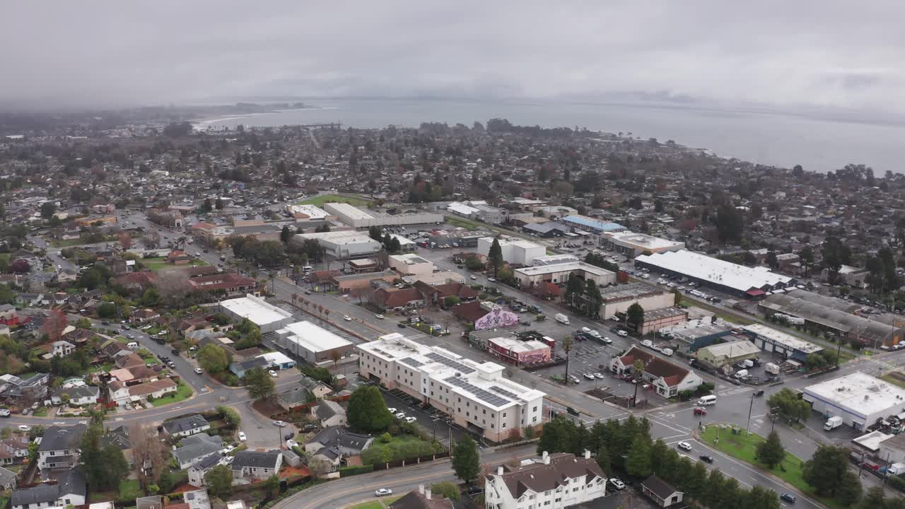 Aerial wide panning shot of foggy Santa Cruz, California. 4K