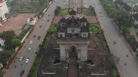 drone view of famous victory gate at vientiane during sunrise, aerial