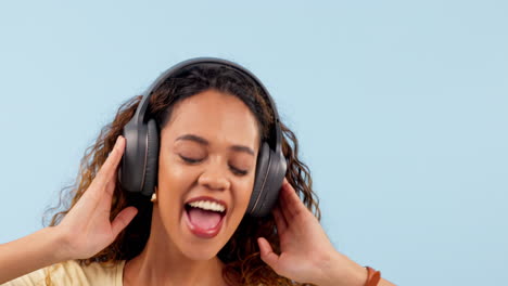 headphones, happy and woman singing in a studio
