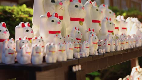 gotokuji temple, close up of hundreds of lucky cat dolls in tokyo japan 4k