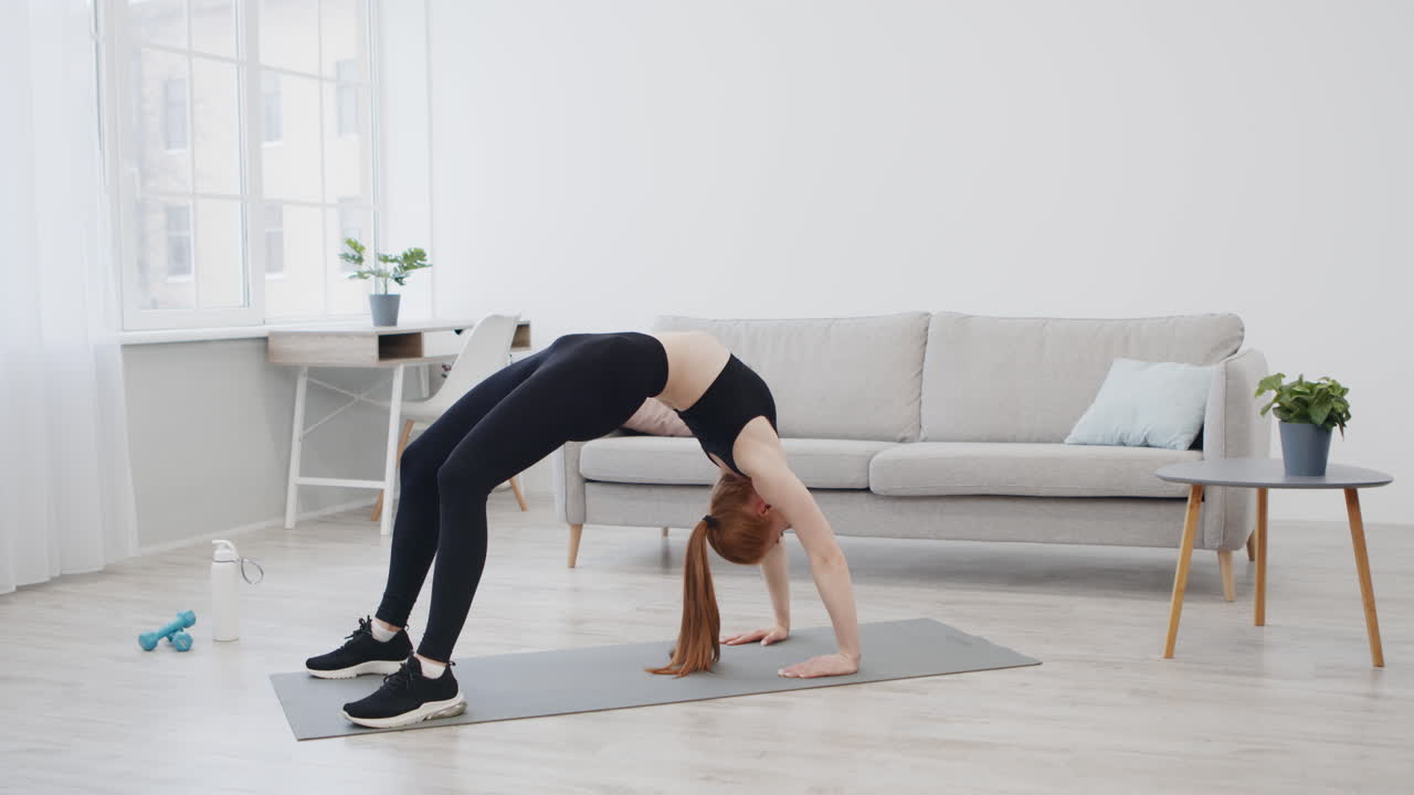 Woman Doing a Backbend Yoga Pose at Home