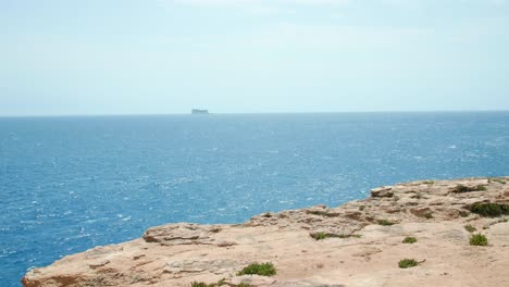 island of filfla at a distance shot from wied iz-zurrieq, the island is a bird sanctuary off of the coast of malta