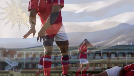 animación de la bandera de uruguay sobre diversos jugadores de rugby masculinos jugando en el estadio