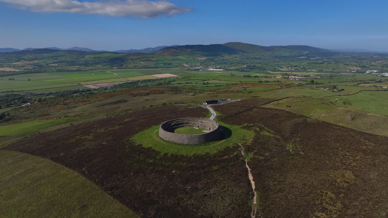 Grianan of Aileach, County Donegal, Ireland, June 2023. Drone wide-angle counter clockwise ascending orbit of the imposing Gaelic stone Ringfort with the spectacular view north towards Drongawn Lough.