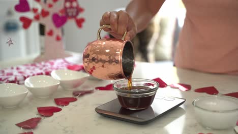 Pouring-a-cup-of-coffee-into-a-small-bowl-making-a-special-valentine's-day-cake-vegan-chocolate-cake-eggless-plant-based-dairy-free