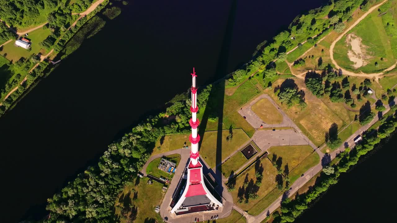Cinematic drone flight downward angle over Riga TV Tower and Zaķusala island