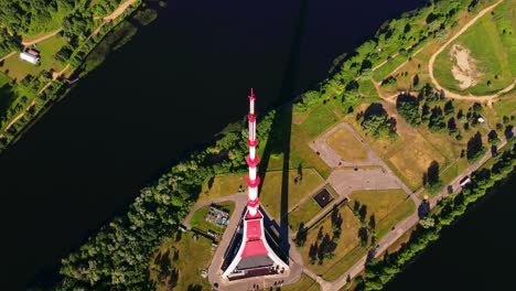 cinematic drone flight downward angle over riga tv tower and zaķusala island