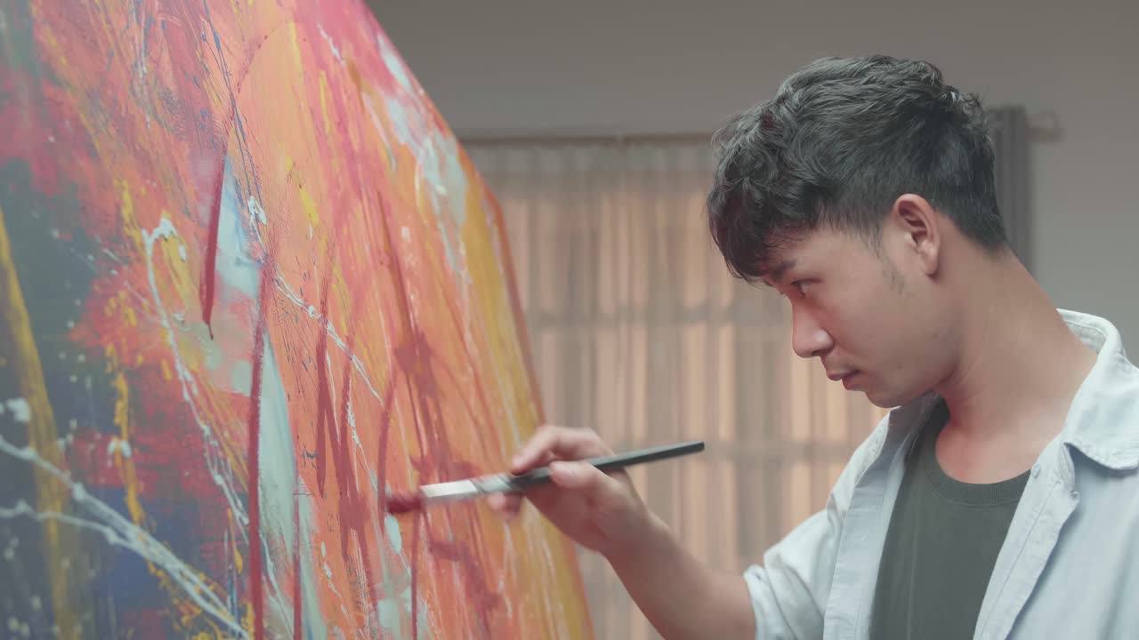 Man Artist Works On Abstract Oil Painting