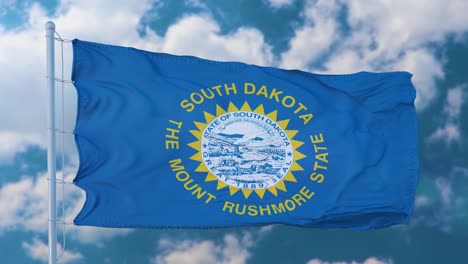 south dakota flag on a flagpole waving in the wind, blue sky background