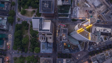 AERIAL:-Day-to-Night-Hyper-Lapse-/-Motion-Time-Lapse-of-Frankfurt-am-Main-Germany-Skyline-Overhead-Top-Down-View-with-beautiful-city-lights-and-Car-Traffic