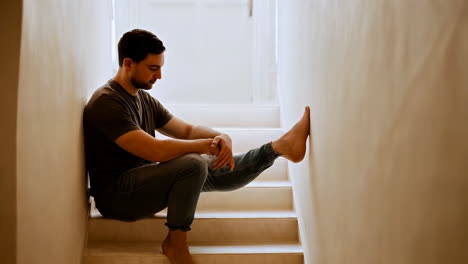 a man sitting casually on a staircase