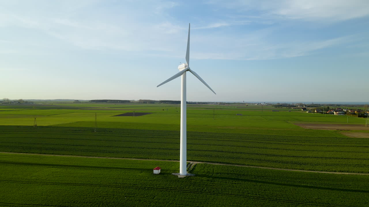 Dolly up aerial of wind turbines in the agricultural landscape of Puck Ploand