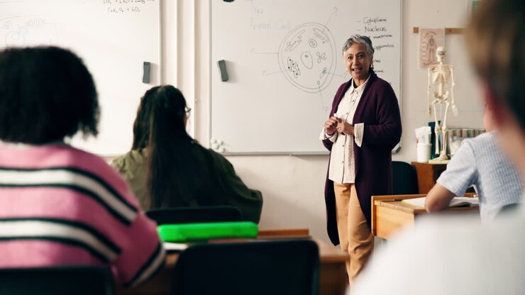 Teacher Explaining Biology to Students in Classroom