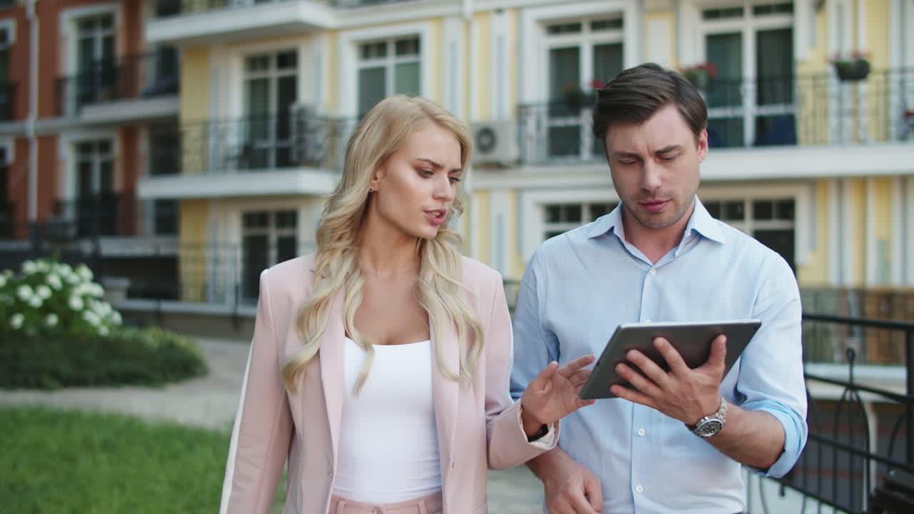 Closeup business couple discussing work. Business partners talking together