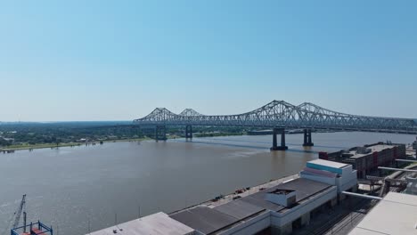 crescent city connection bridge spanning mississippi river in new orleans, louisiana, usa. - aerial shot