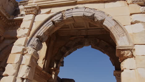 looking up at stone archway in ephesus