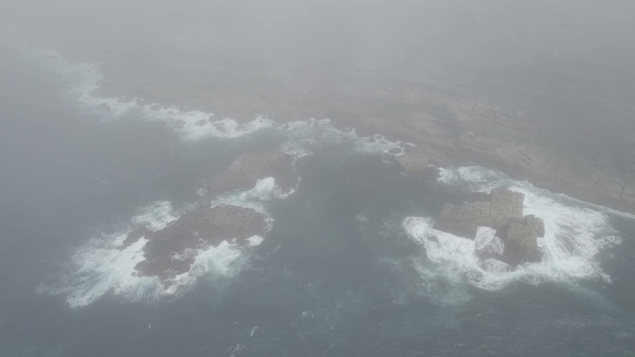 Dense Sea Fog Covered The Rocky Shore With Breaking Waves In Tamarama Beach, Sydney, Australia