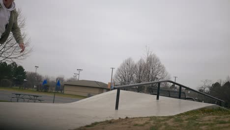 skater does a crazy flip trick to board slide