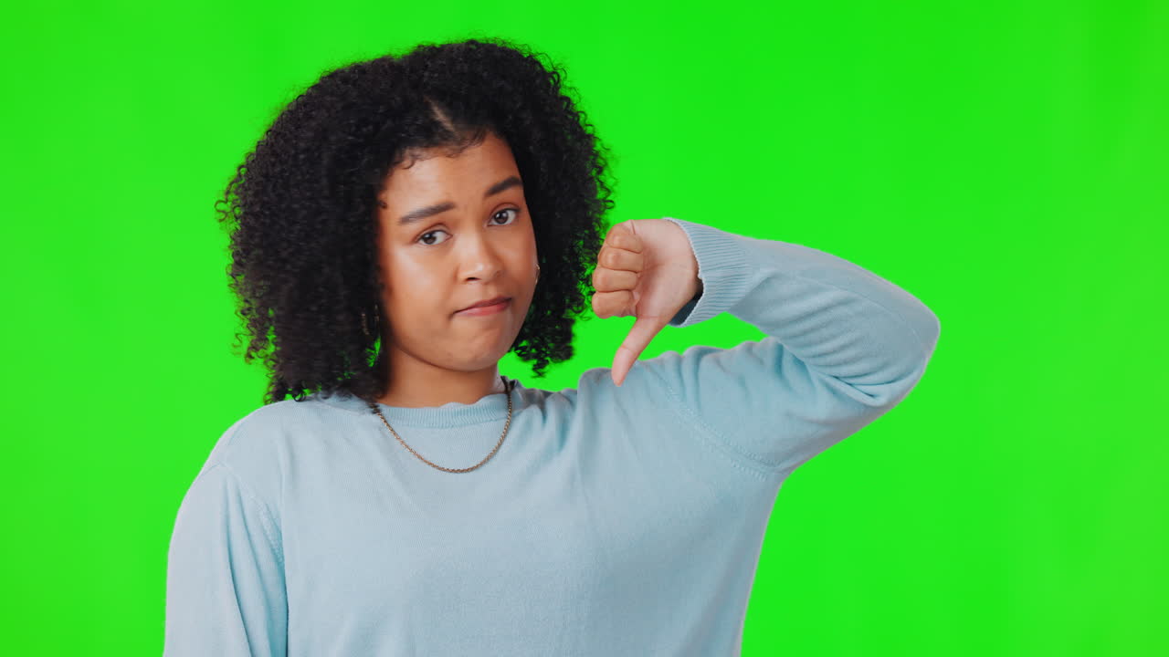 Face, green screen and woman with thumbs down