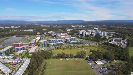 bright colors of the building structures of gold coast university hospital beside the rugby field in queensland, australia