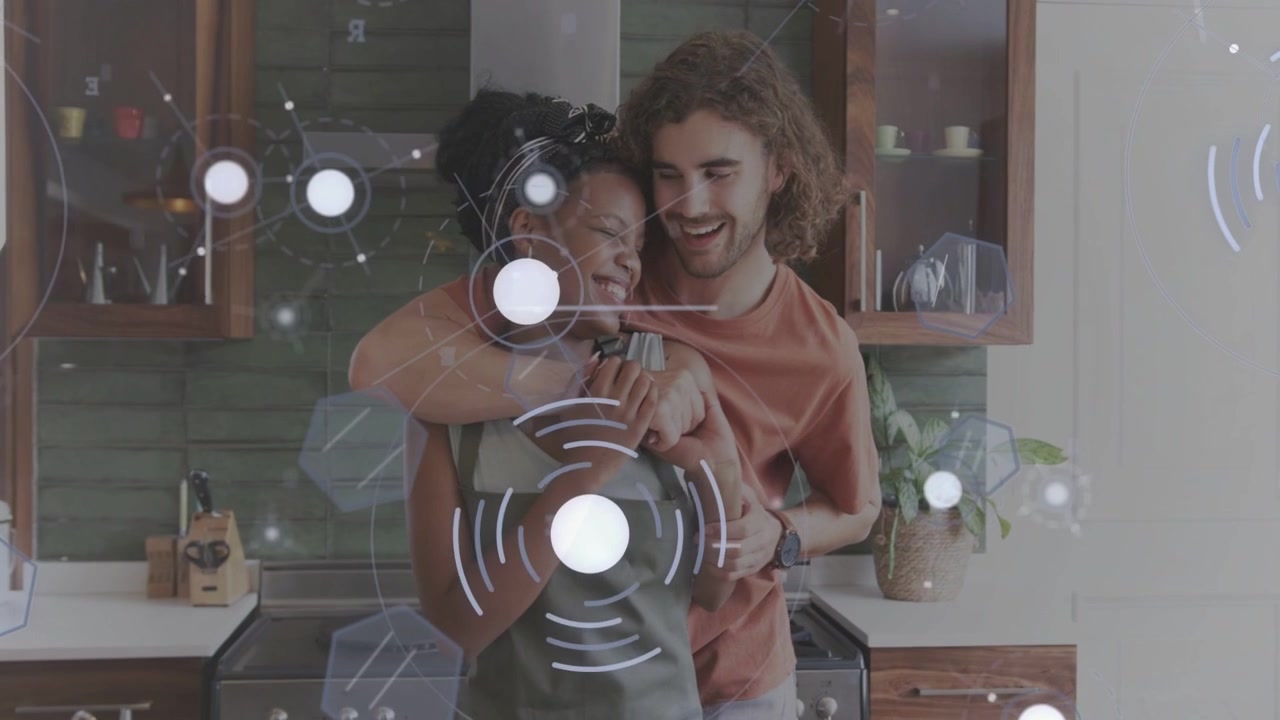 Woman in apron reaching during cooking, man guiding turn and hugging showing love, HUD syncing