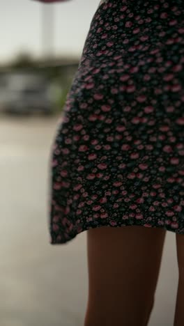 woman in a floral skirt