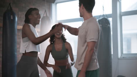 group of friends celebrating after a workout