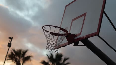 Lucky-basketball-point-after-bouncing-off-backboard-and-rim,-in-slow-motion