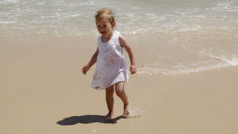 Cute-little-girl-pointing-out-to-sea