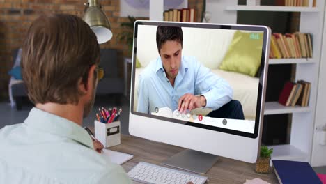 Caucasian-male-teacher-using-computer-on-video-call-with-male-student