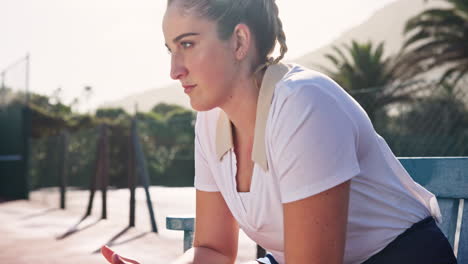 female tennis player resting