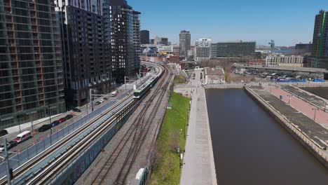 drone following rem subway train driving around montreal quebec city avoiding air pollution agenda 2030 concept