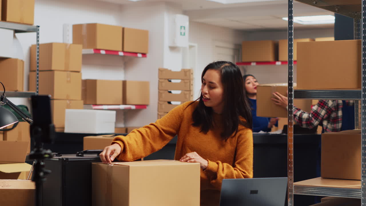 Warehouse workers preparing orders for shipment