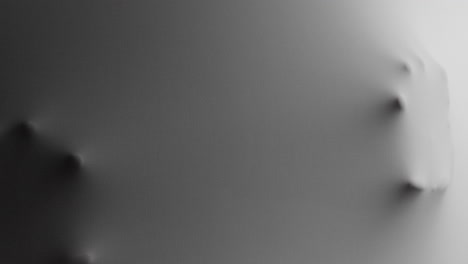 a scary face and hands appear from the white surface