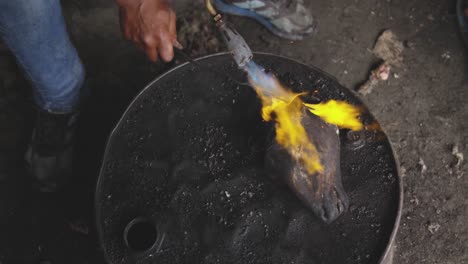 african man burning the meat