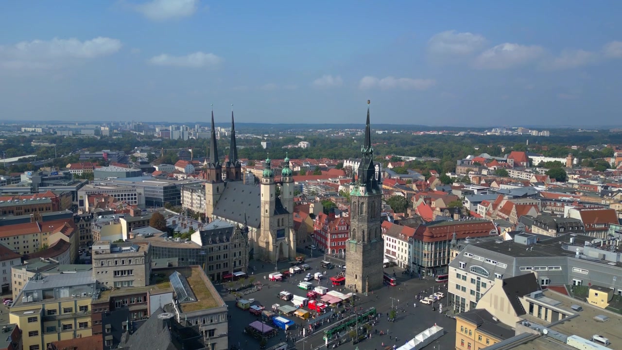 market square with the red tower and st. Mary's church in halle saale, germany. Unbelievable aerial view flight ascending drone