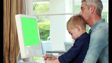 Happy-father-and-son-computer-together