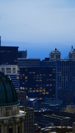 city skyline with a historic dome at dusk in a busy urban area