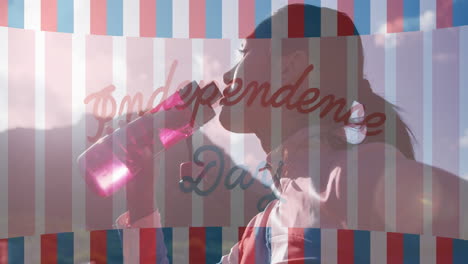 animation of independence day text over biracial woman drinking water and hiking