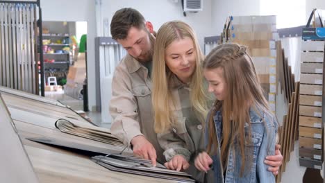 family viewing tile display at building store for house renovation project