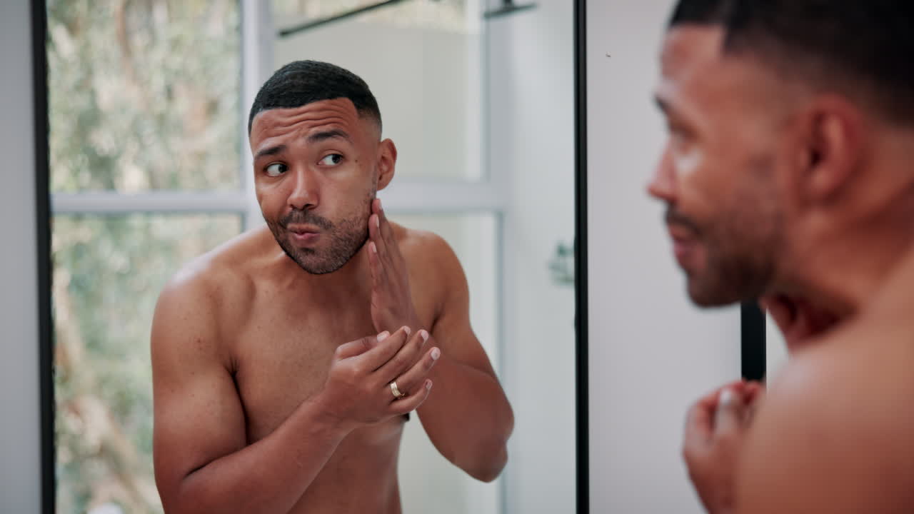 Man grooming himself in the mirror