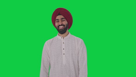 sikh indian man laughing on someone green screen