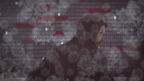 animación de células macro coronavirus covid-19 que se extienden sobre hacker hombre encapuchado con grabaciones de datos