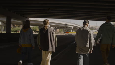 dance crew walking on the road