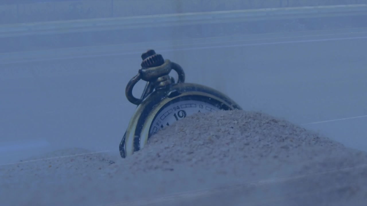 Vintage Pocket Watch Buried in Sand with City Traffic Overlay